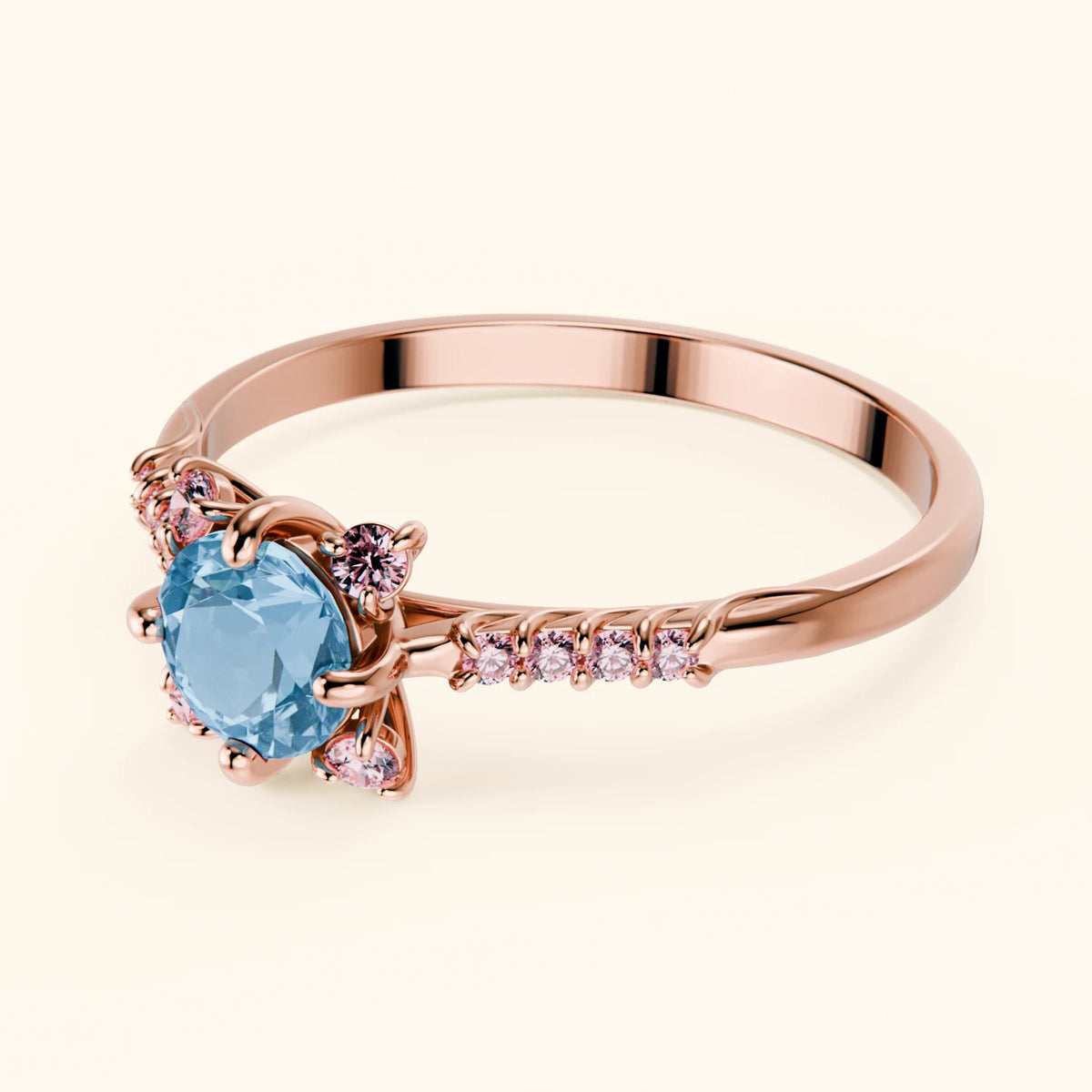 Pierścionek zaręczynowy Scintille – Topaz Swiss Blue 0,50 ct, kamienie boczne: różowy diament laboratoryjny
