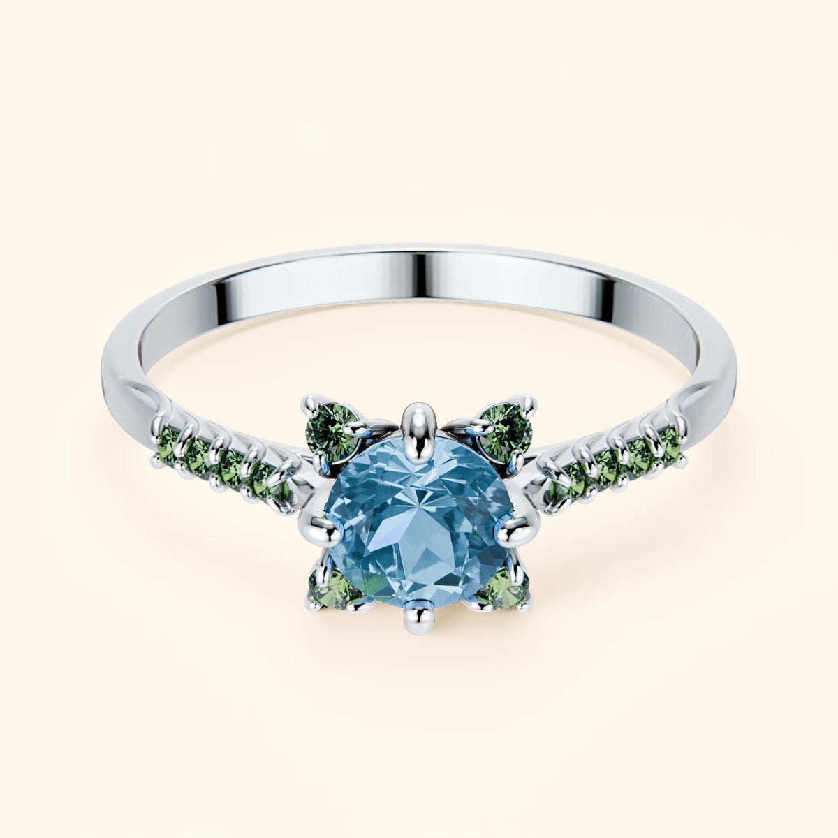 Pierścionek zaręczynowy Scintille – Topaz Swiss Blue 0,50 ct, kamienie boczne: zielony diament laboratoryjny
