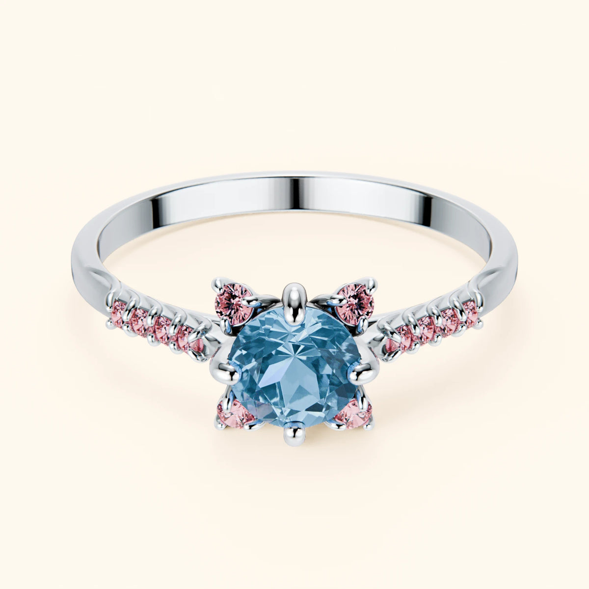 Pierścionek zaręczynowy Scintille – Topaz Swiss Blue 0,50 ct, kamienie boczne: różowy diament laboratoryjny