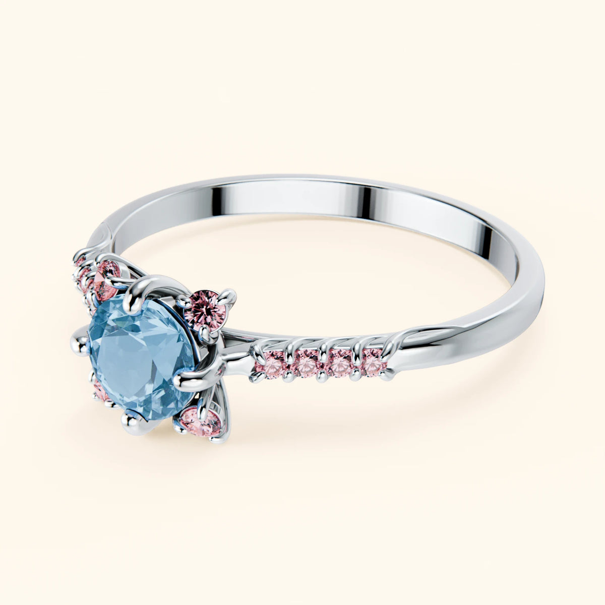 Pierścionek zaręczynowy Scintille – Topaz Swiss Blue 0,50 ct, kamienie boczne: różowy diament laboratoryjny